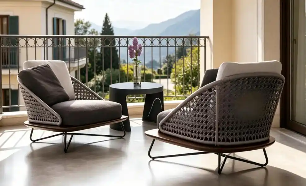 Outdoor balcony seating with woven grey armchairs