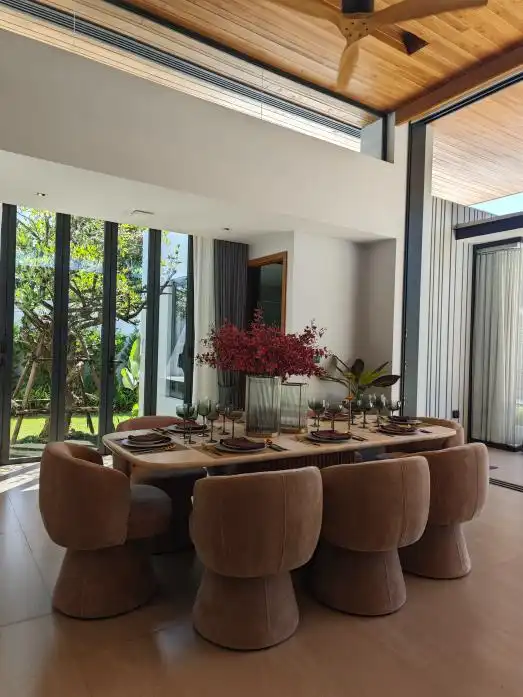 Phuket villa custom furniture project dining room with oval table and beige chairs