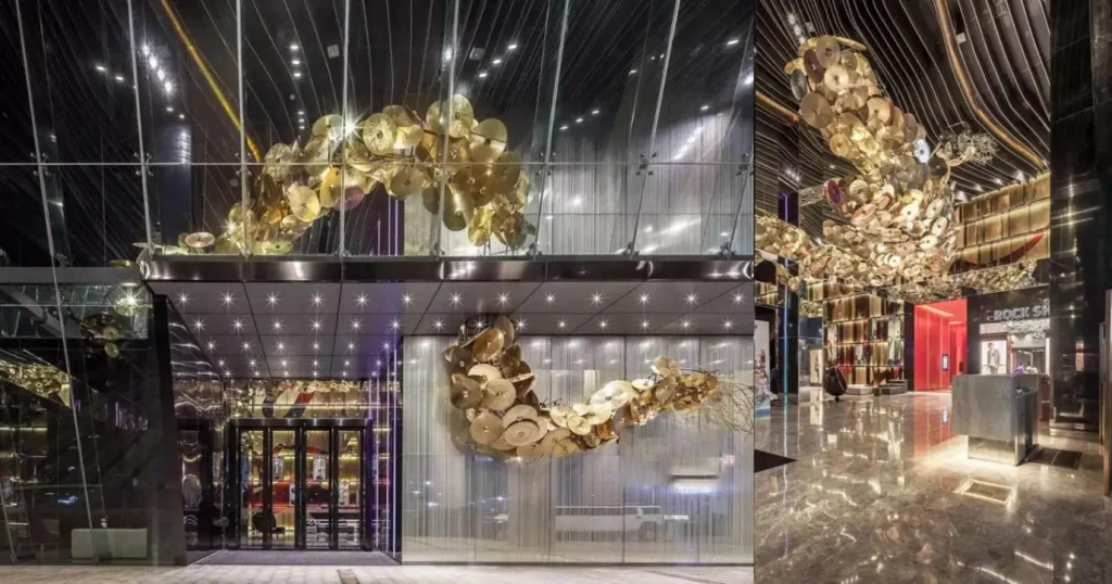 Golden hand-assembled metal ceiling installation in the Mercure Hotel lobby, fitted with furniture supplied by a Foshan factory in China