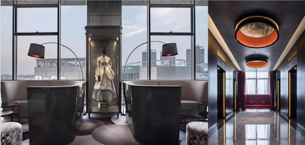 Curved dark lounge sofas with warm accent lighting in a Mercure Hotel upper-floor lounge and elevator hall, custom-made by a Chinese furniture manufacturer